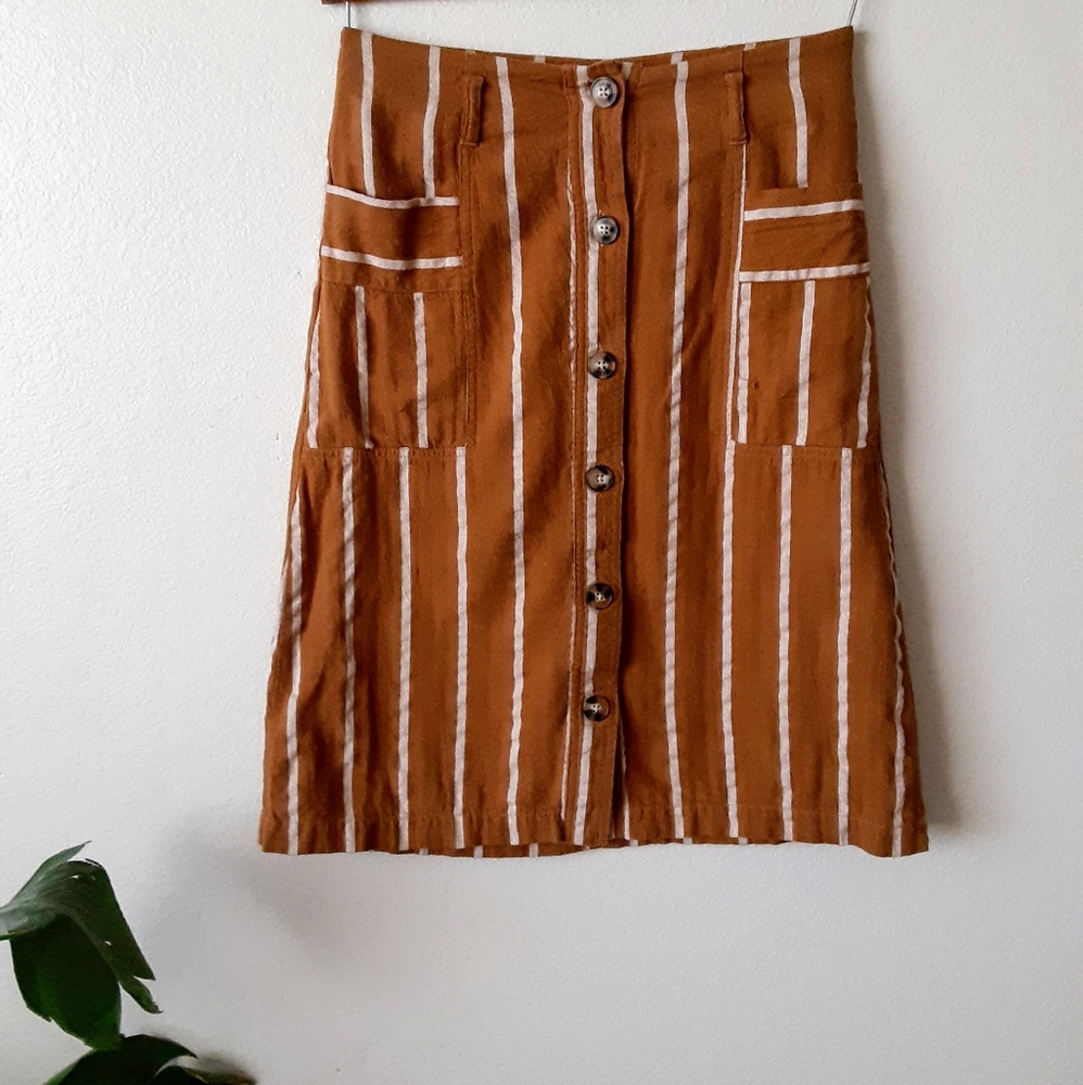 Striped A-line button front mustard colored skirt.